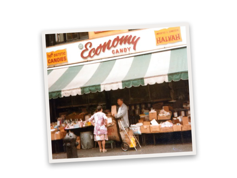 A photo of the Economy candy storefront on a background of jelly beans